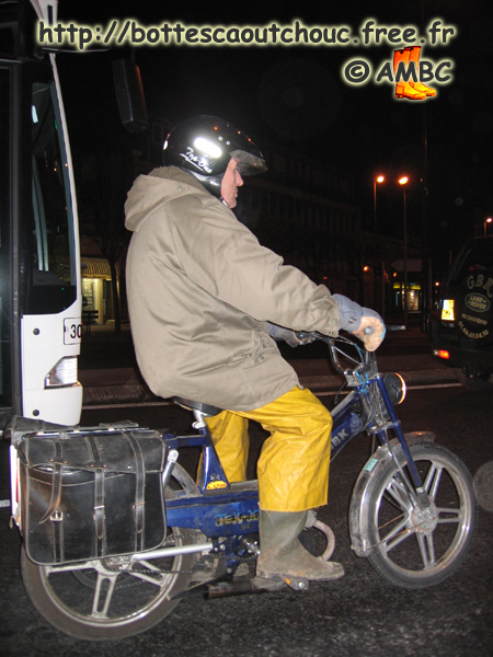 A biker wearing PVC & boots,  rue Thiers, in Melun.