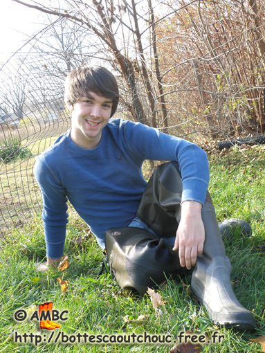 Cody in waders in the country, Michigan, U.S.A.
