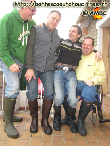 4 Mates laughing  in wellies; at the House of the Rubber Boot, France, Feb. 2011.