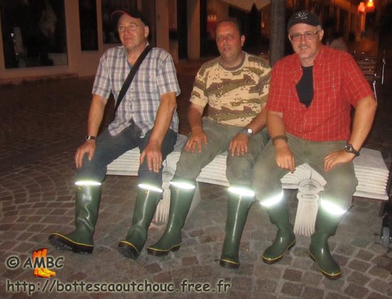 Rubberbooted fans wearing J. Deere wellies in Melun streets; France,  Sept. 2011.