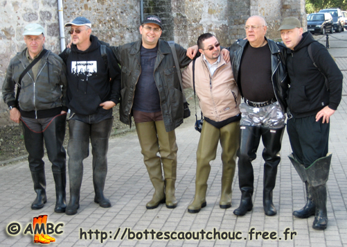 Six mates wearing waders in the street, Oct. 2007. Gummi Waders.