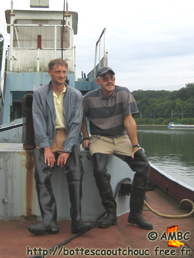 Alain & Pascal, wearing waders on a boat on the Seine river, July 2005.