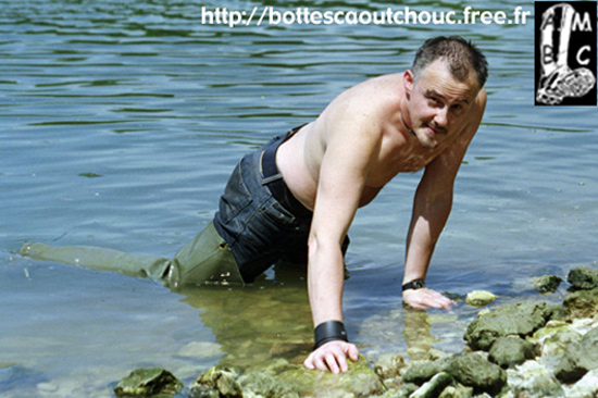 In green waders in the Seine river.